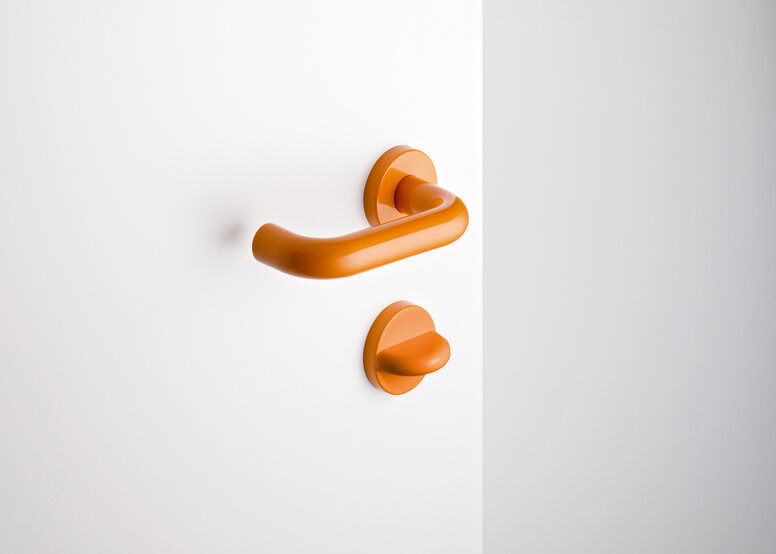 HEWI Türdrücker System 111 Frei-Besetzt-Garnitur in der Farbe Orange im Rundrohrdesign