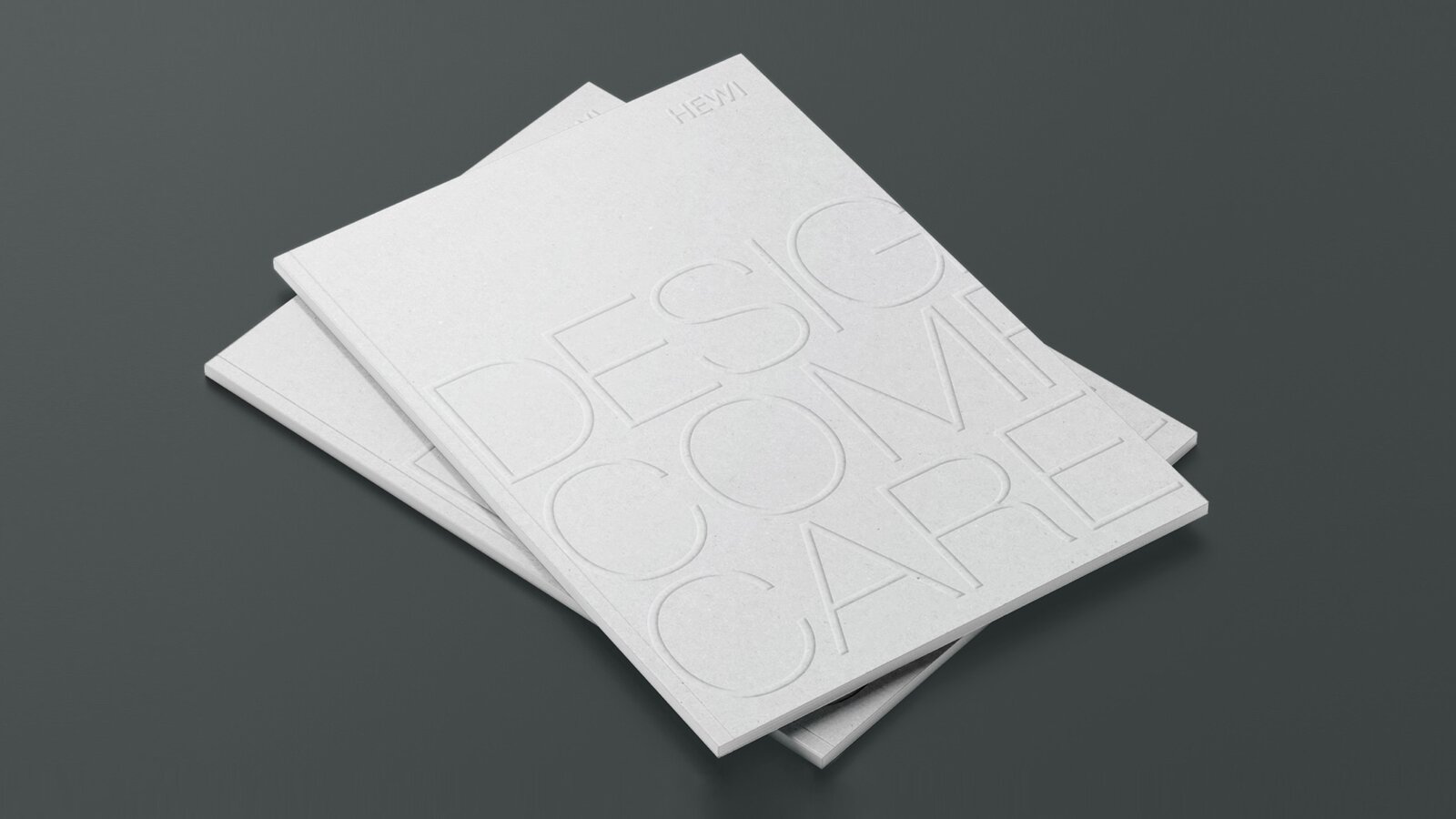 Design Comfort Care Deux brochures superposées portant l'inscription Design Comfort Care