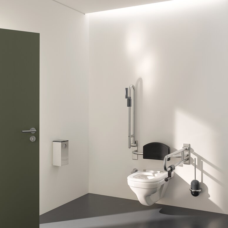 HEWI barrier-free WC Barrier-free WC in public areas equipped with folding support handles, backrest and toilet brush